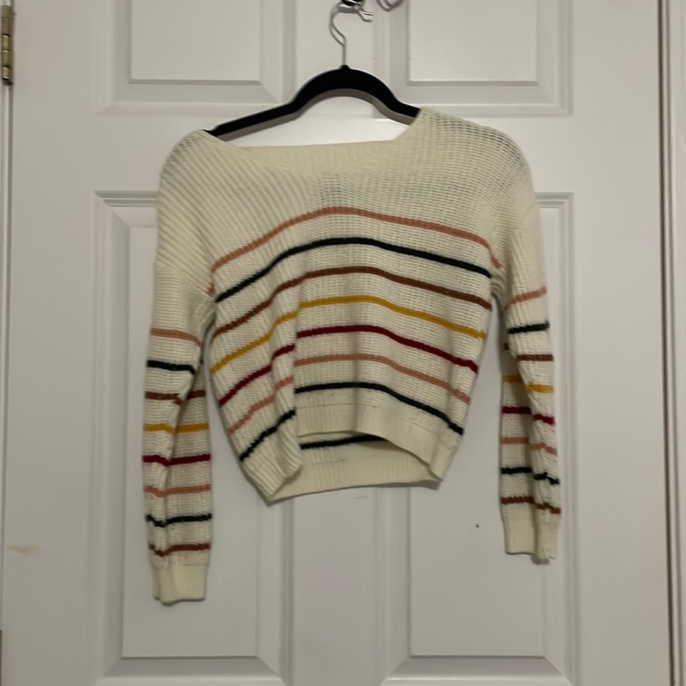 Cute rainbow sweater, it’s not to warn
